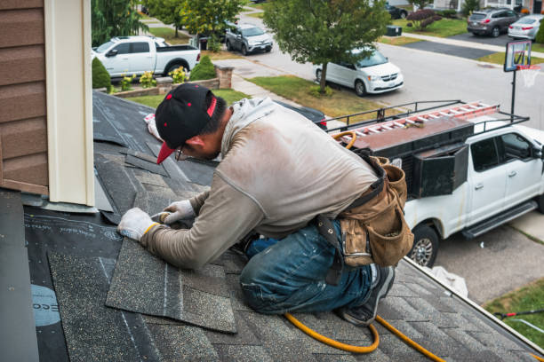 Professional Roofing technician working in Geneva, IA